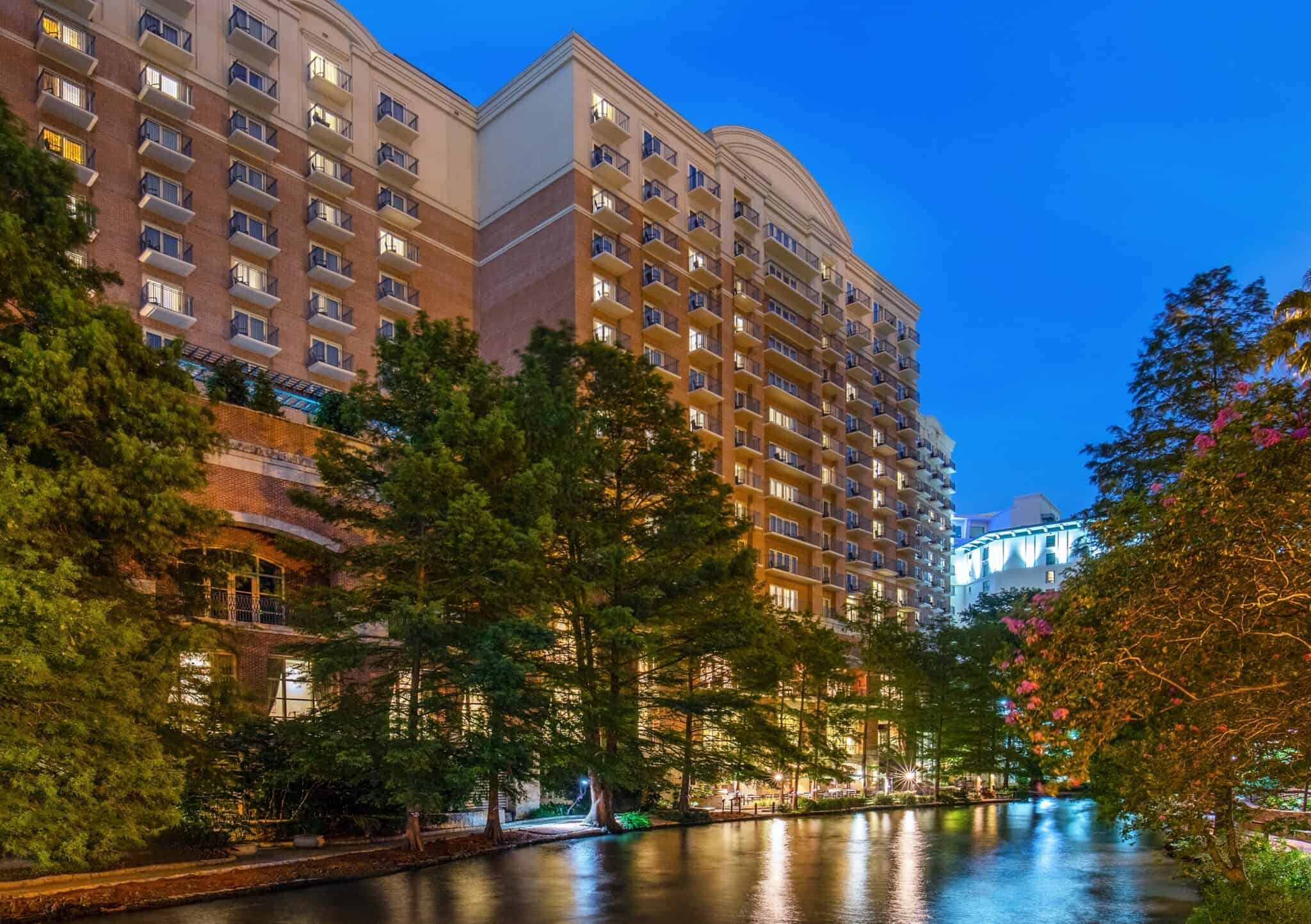 The Westin Riverwalk San Antonio tower at dusk from the River Walk