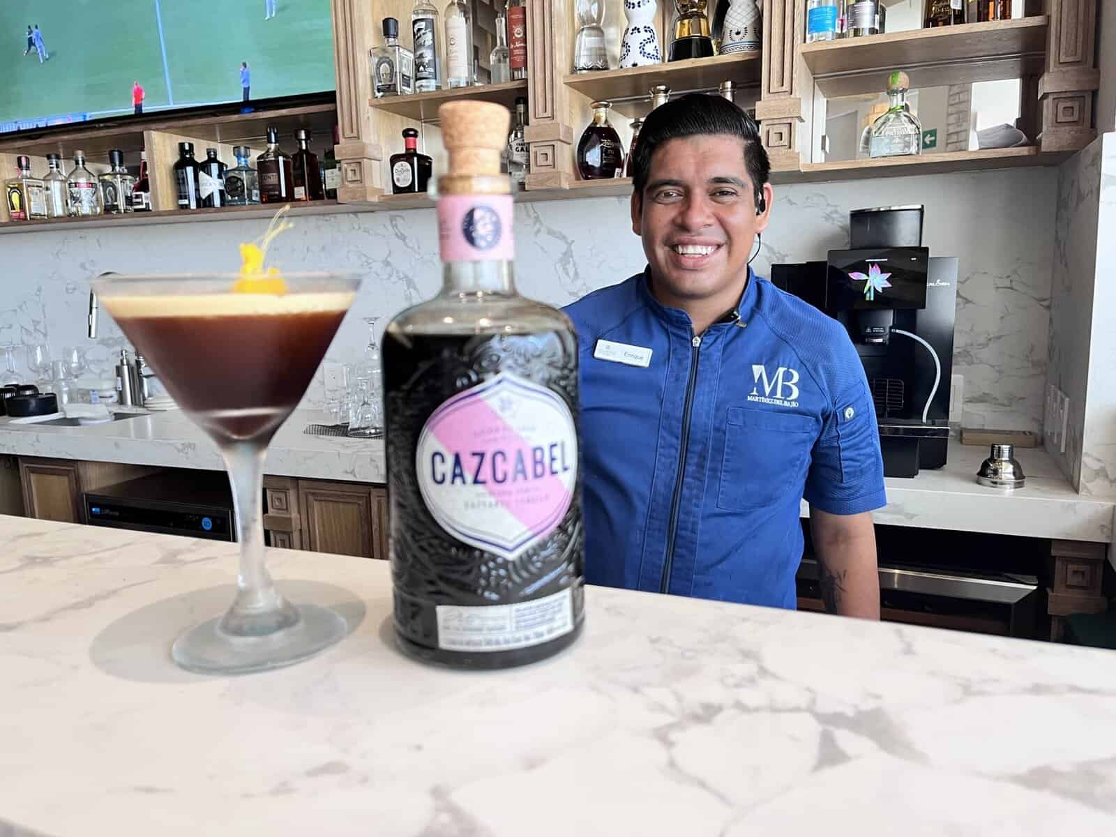 A man standing with a drink 