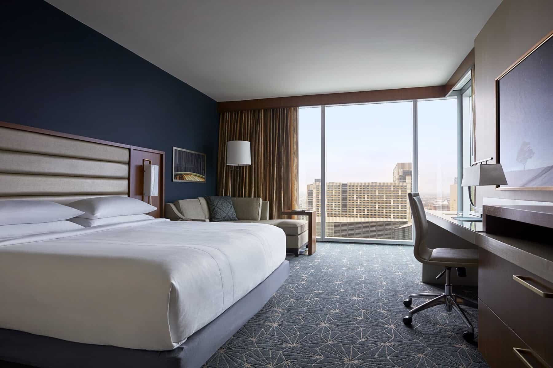 A king bed in a hotel room.