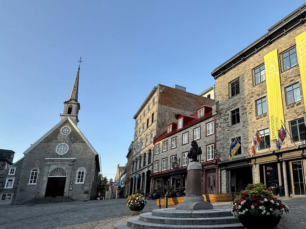 Cobblestone Place Royale square with Notre-Dame-des-Victoires Church, the oldest stone church in Old Quebec.