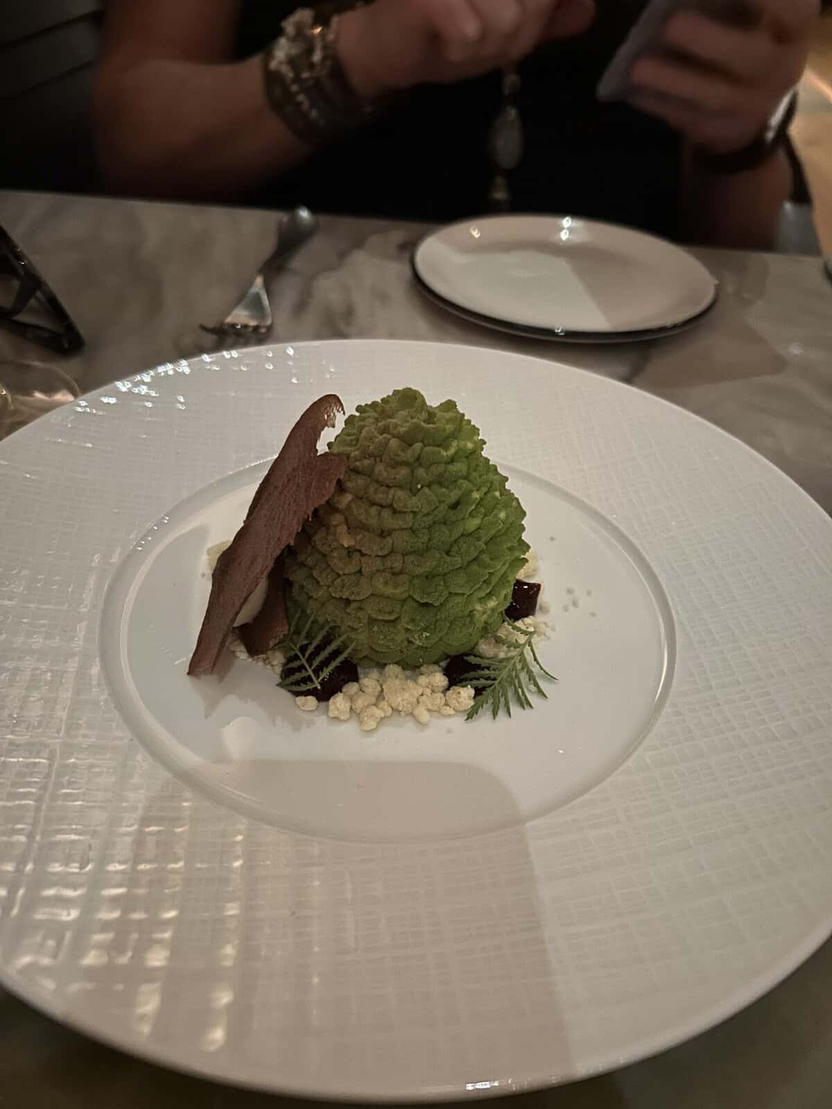Loblolly pine dessert with chocolate garnish and pine-inspired presentation at River House.