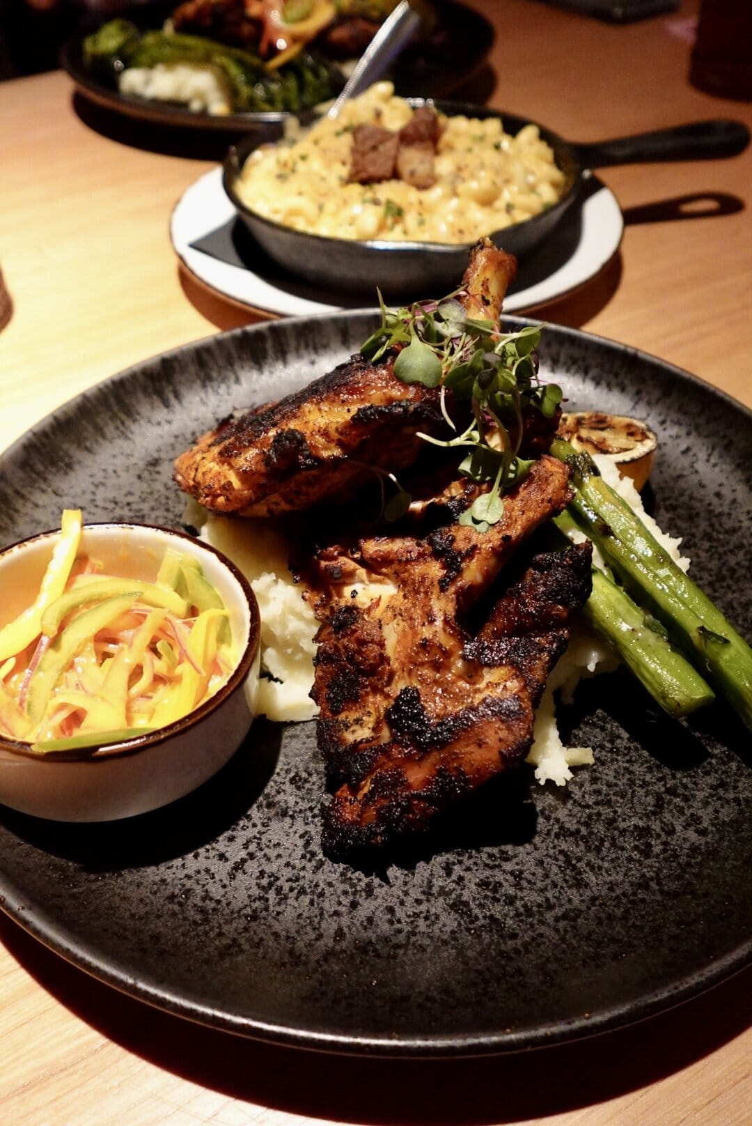 Plate with chicken, mashed potatoes, and greens.