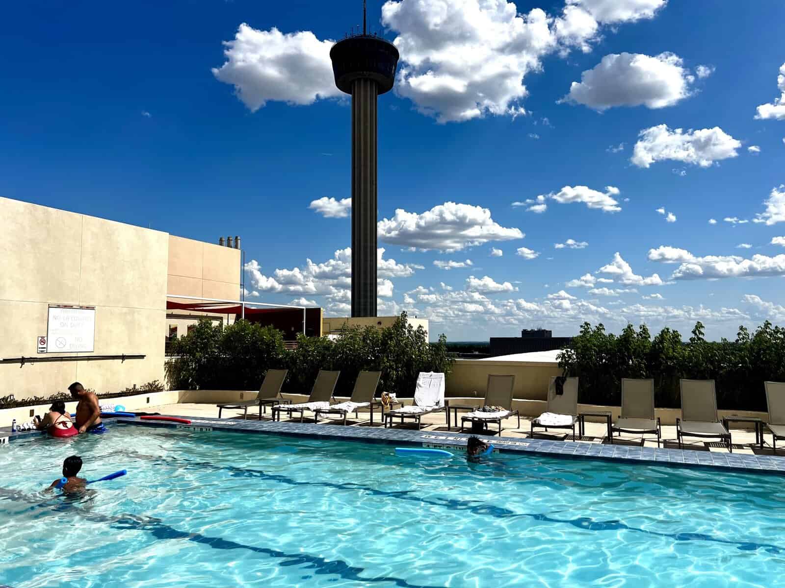rooftop pool with the Tower of the Americas in the background