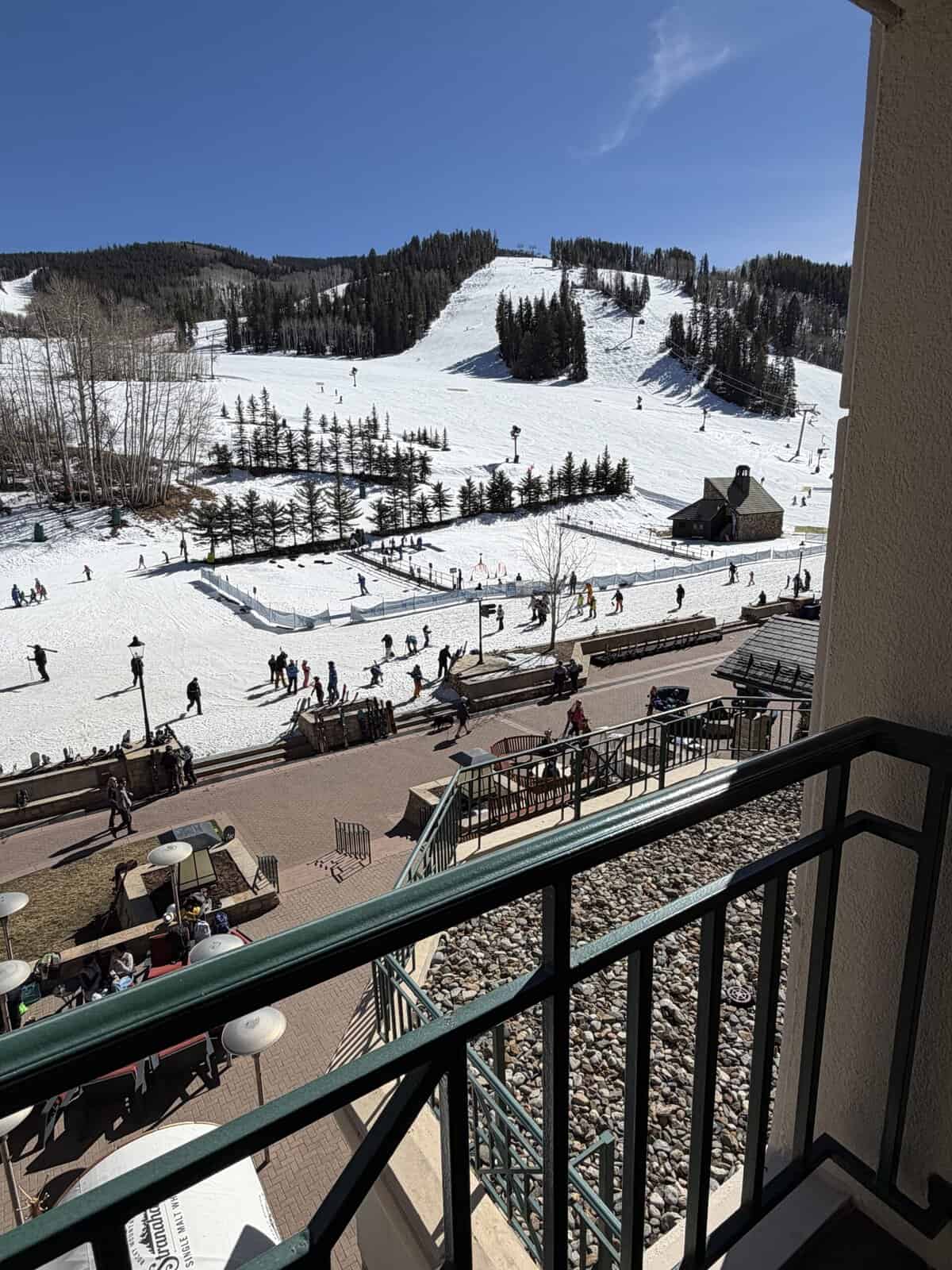  View of skiers from balcony of Beaver Creek ski resort.