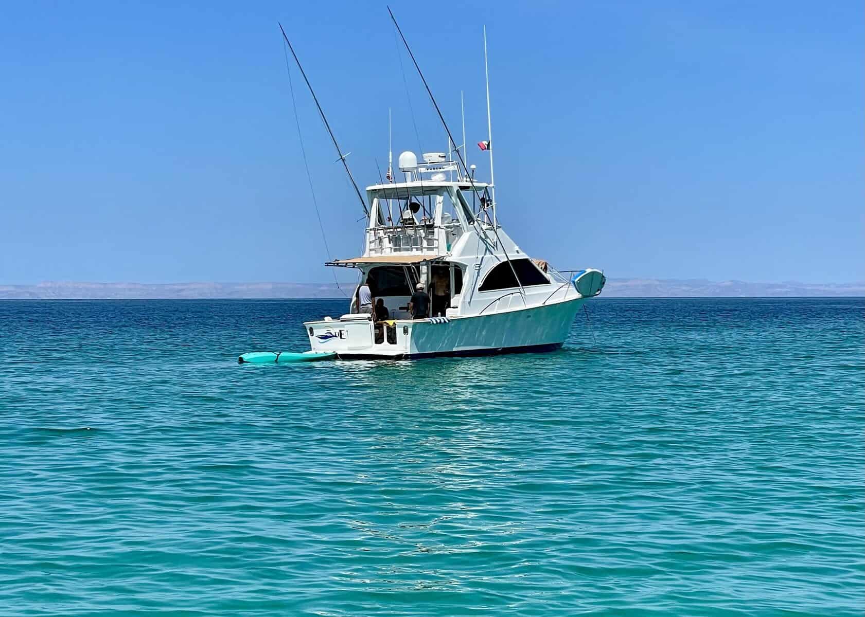 A boat passes on bright, turquoise water